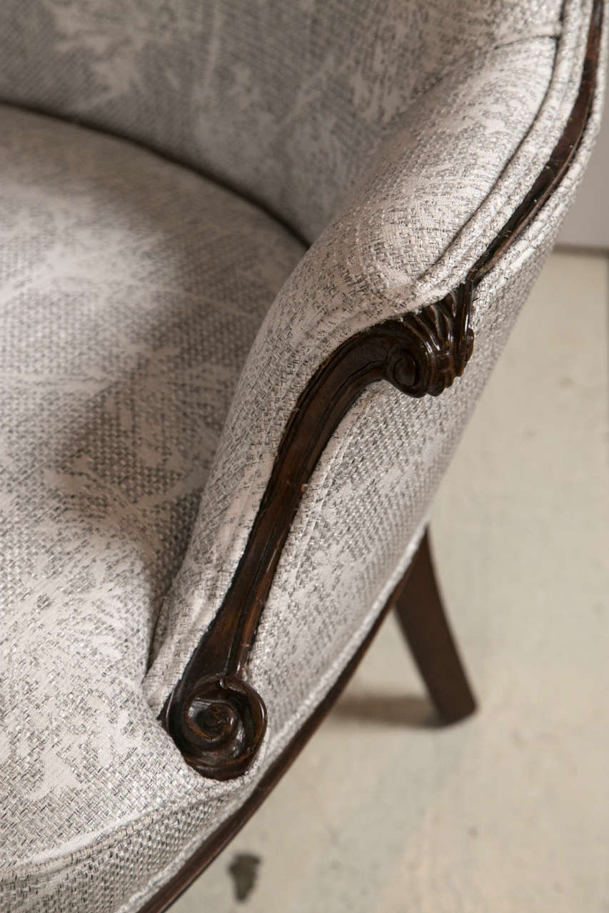 Pair of french heart shaped wing chairs in mahogany legs and detail at