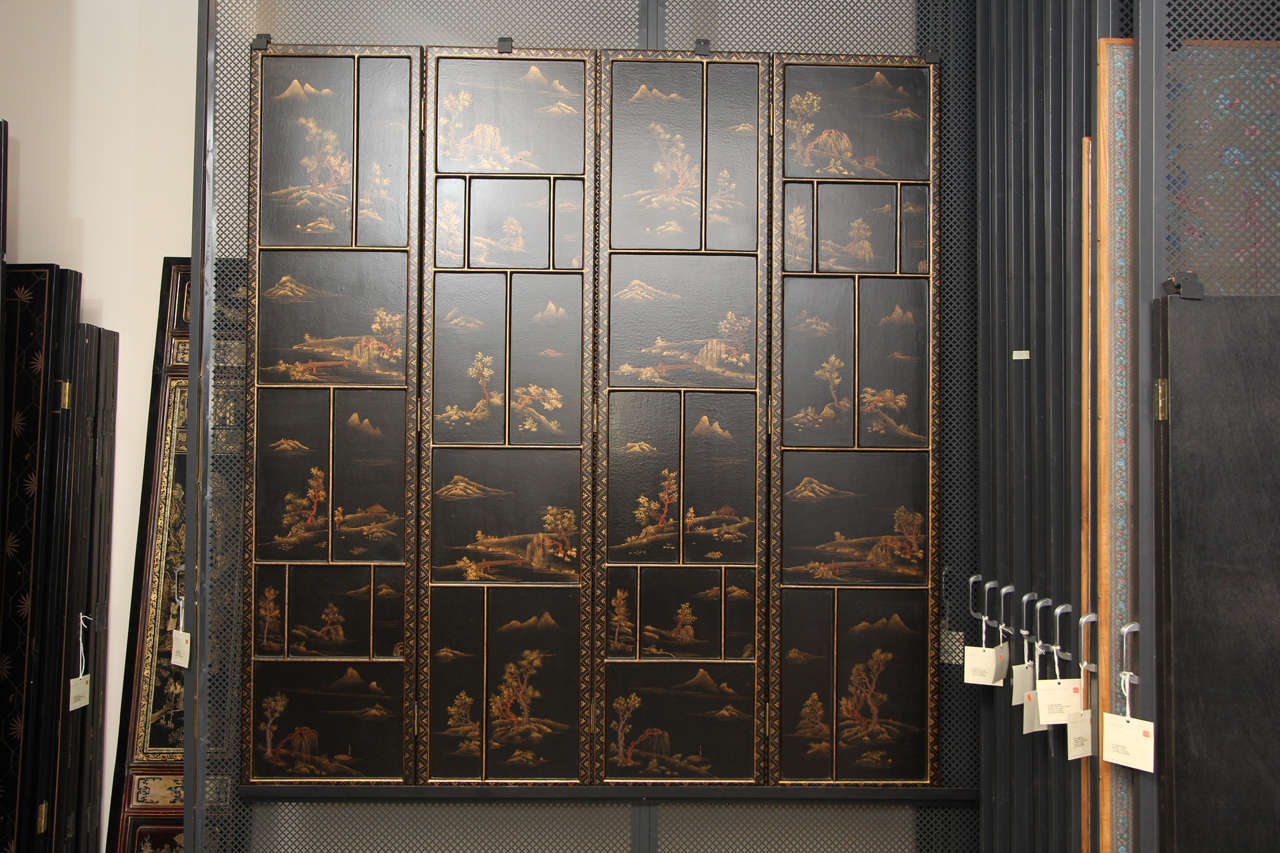 A set of four vintage lacquer panels depicting a Chinese landscape assembled as a screen. Wonderful craquelure finish.