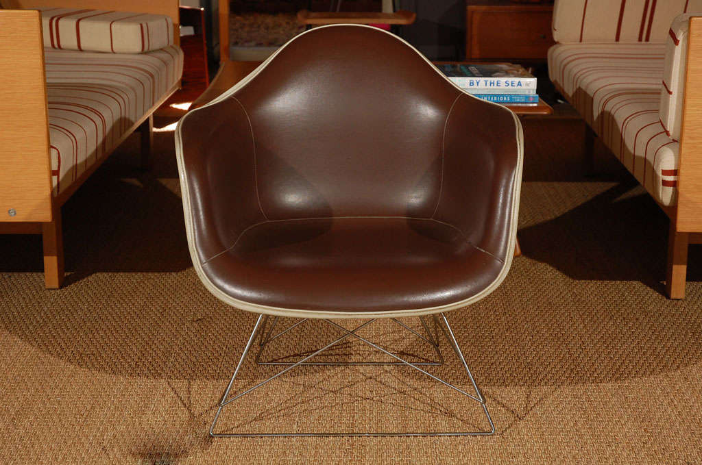 In great condition, these extremely rare Eames chairs feature the original steel rod base and fiberglass-reinforced polyester upholstery. These chairs are exceptional, particularly as they haven't been reproduced in decades. An absolute gem!