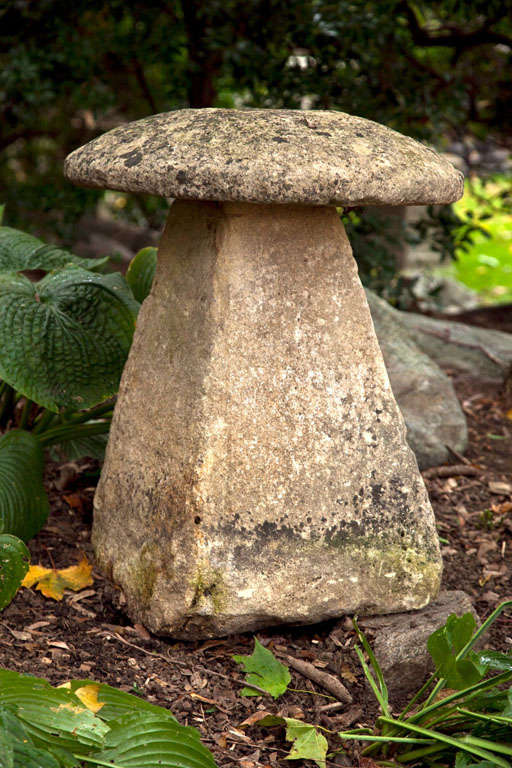 A carved stone staddle stone.