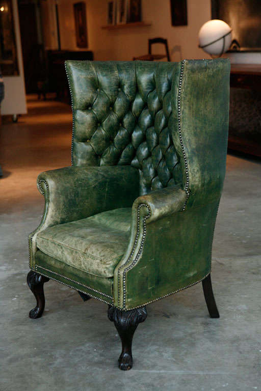 a pair of english clawfoot tufted library chairs from the u.k. <br />
sold only as a pair