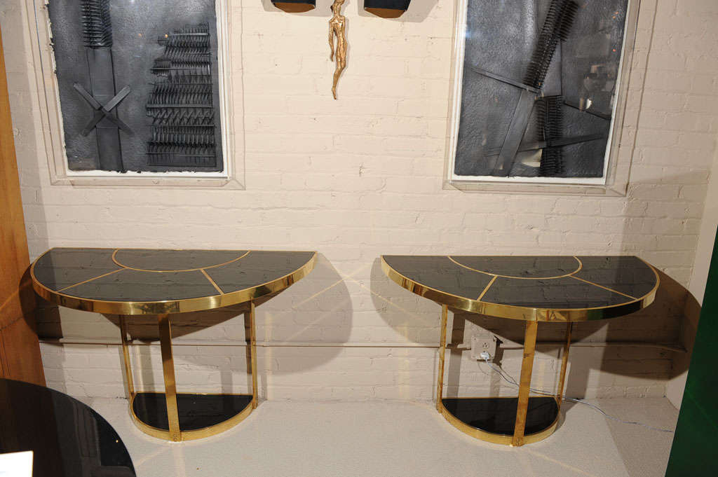 A handsome pair of gilt/bronze and black glass-top console tables by Gabriella CRESPI - Italy- circa 1970