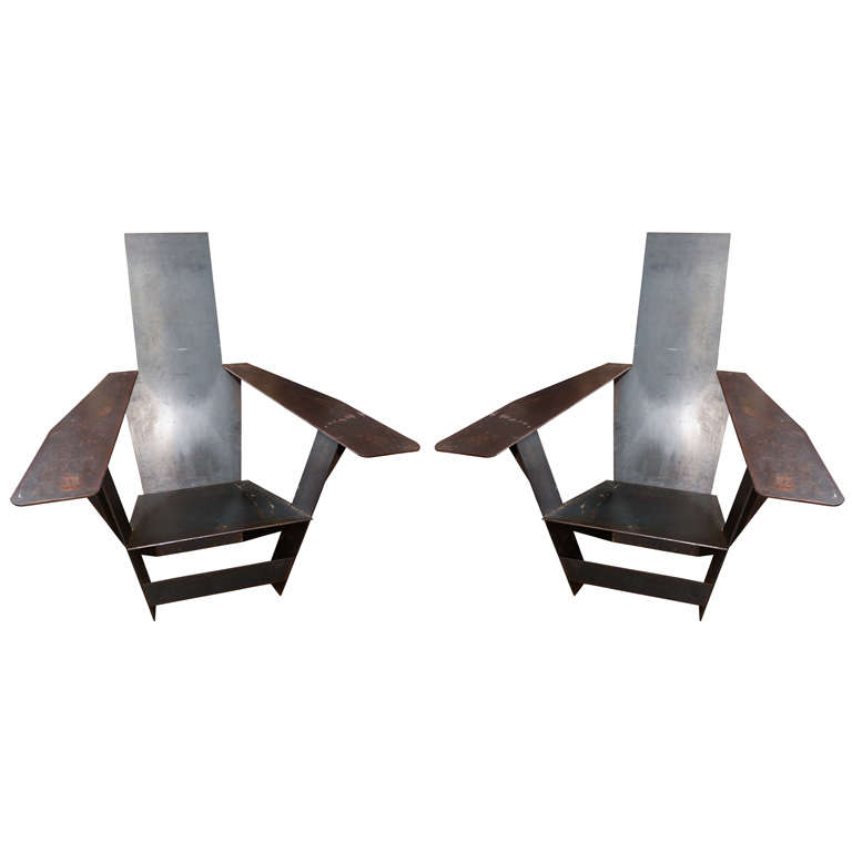 A Unique Pair of Steel Adirondack style chairs.
