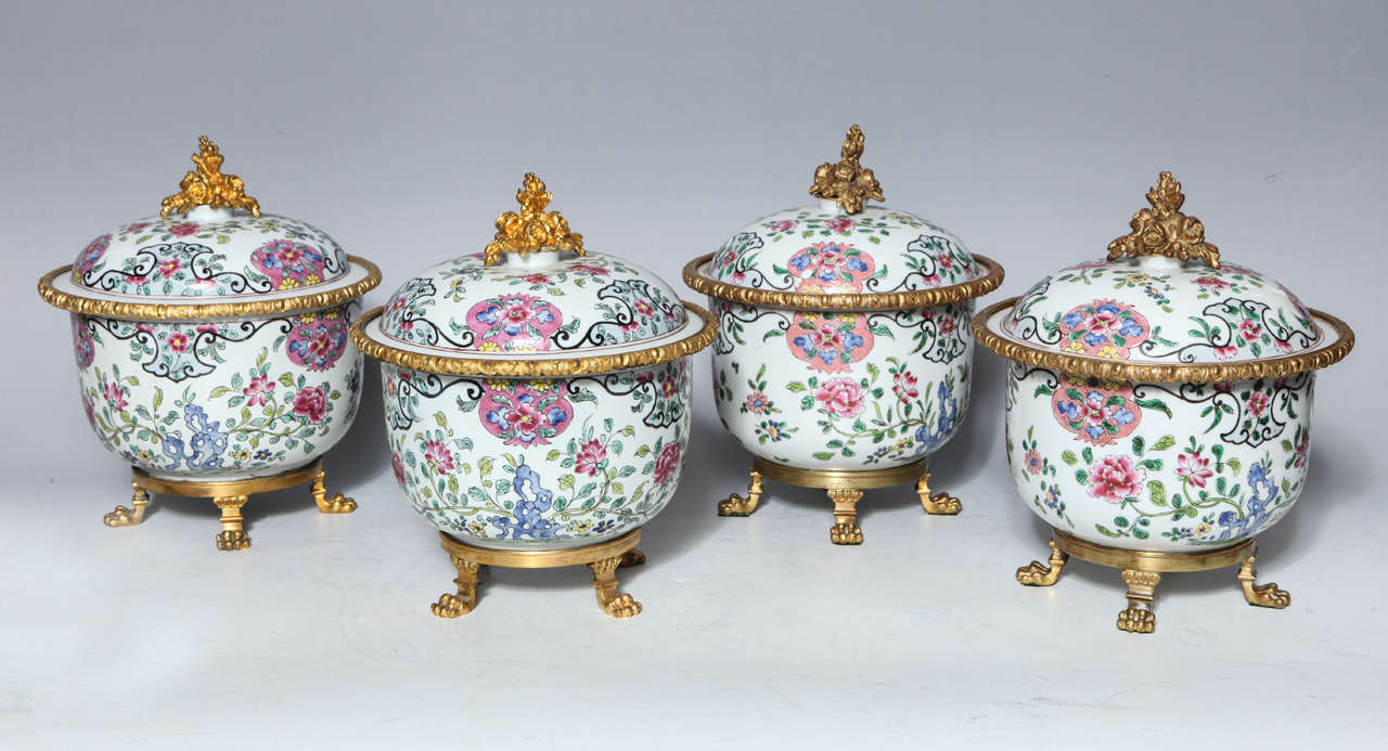 A very fine and unusual set of four antique Chinese Famille Rose porcelain covered compotes, later mounted in French Louis XVI style doré bronze mounts.
The porcelain mid-1800s Chinese and the mounts French Louis XVI style, late 1800's