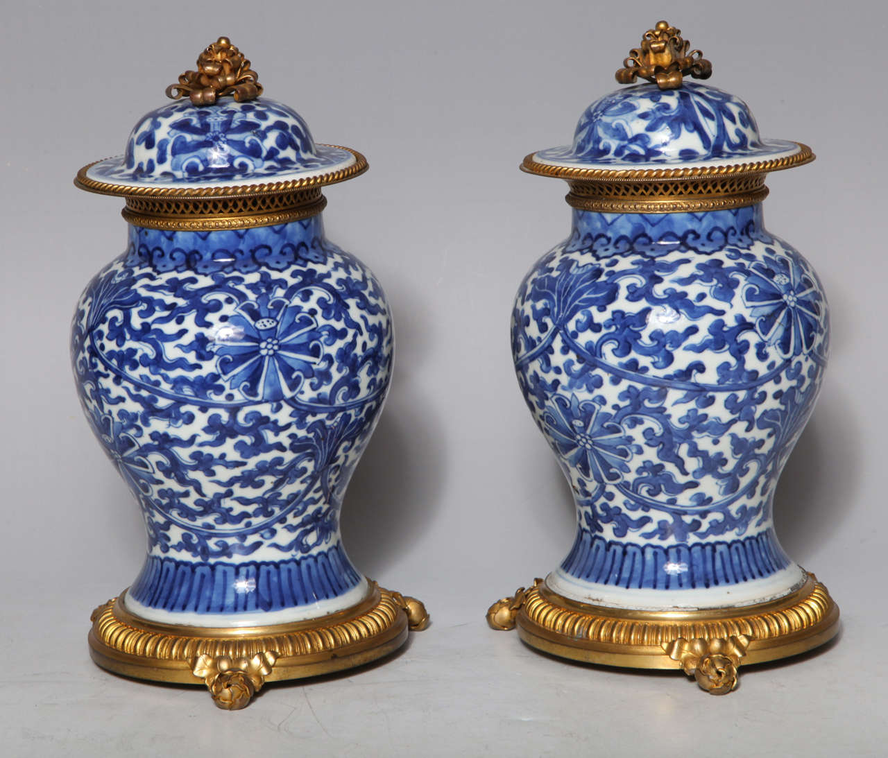 A fine pair of Antique Chinese Blue and White porcelain covered ginger jars, mounted in the Antique French Louis XVI style dore bronze mounts.
The porcelain ca late 1700's to early 1800's Chinese and the ormolu mid to late 1800's French.
