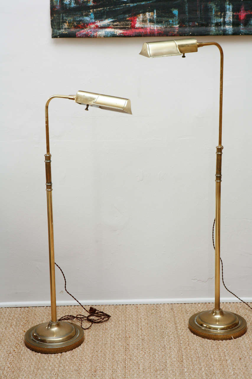 Brass with hooded shades and heavily weighted bases.  Original hardware with updated wiring and cloth cord.  Size extends from                         . Priced individually at $1450 each.