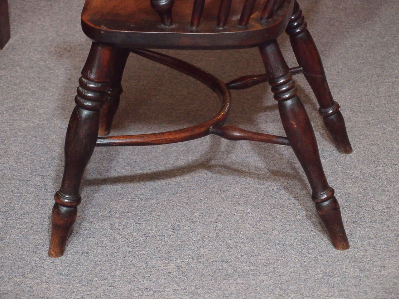 19th Century Antique English elm and ash Windsor chair with crinoline stretcher.