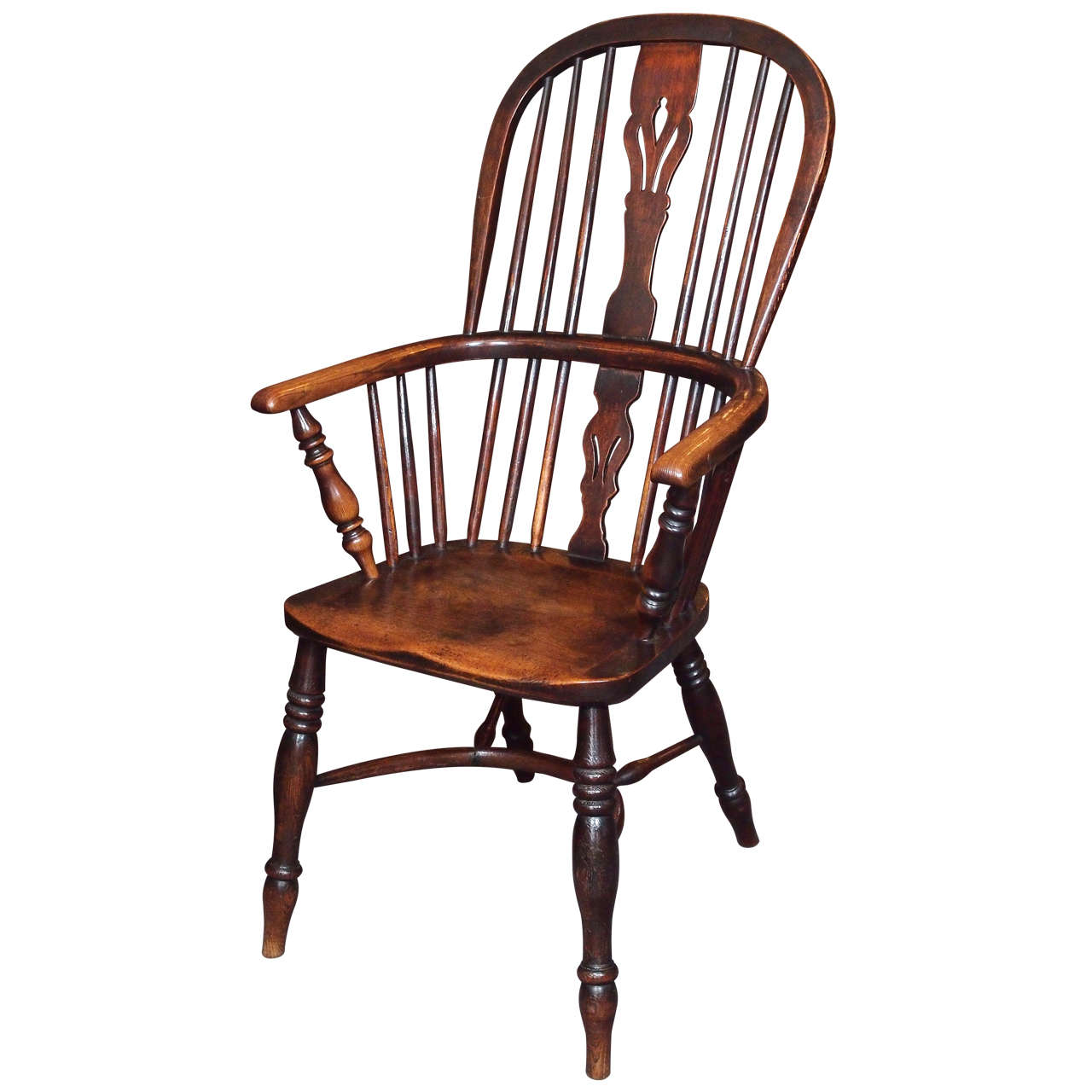 Antique English elm and ash Windsor chair with crinoline stretcher.