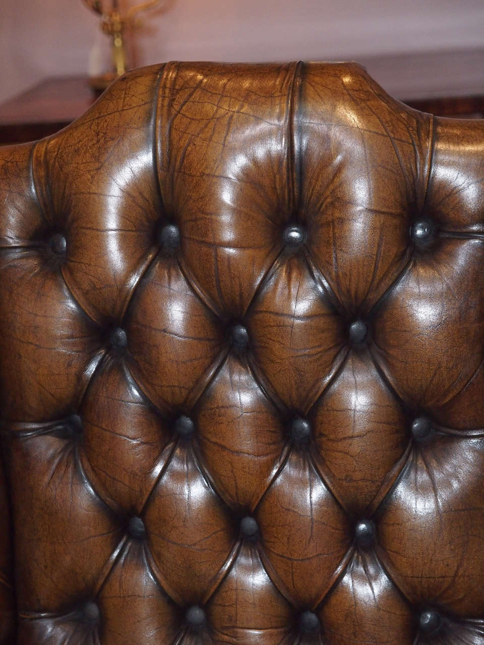 Antique English brown leather wing chair. In Good Condition In New Orleans, LA