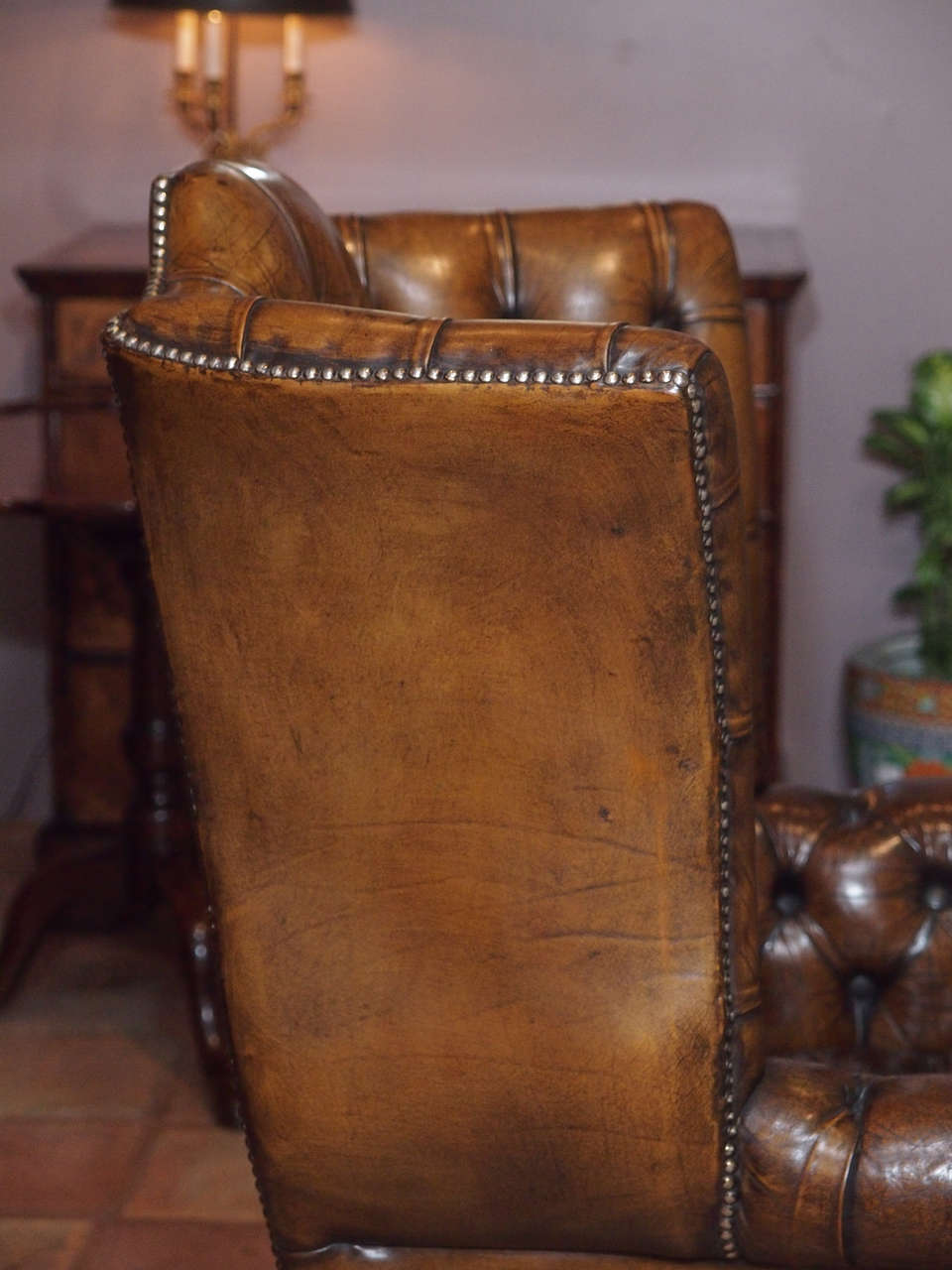 Antique English brown leather wing chair. 2