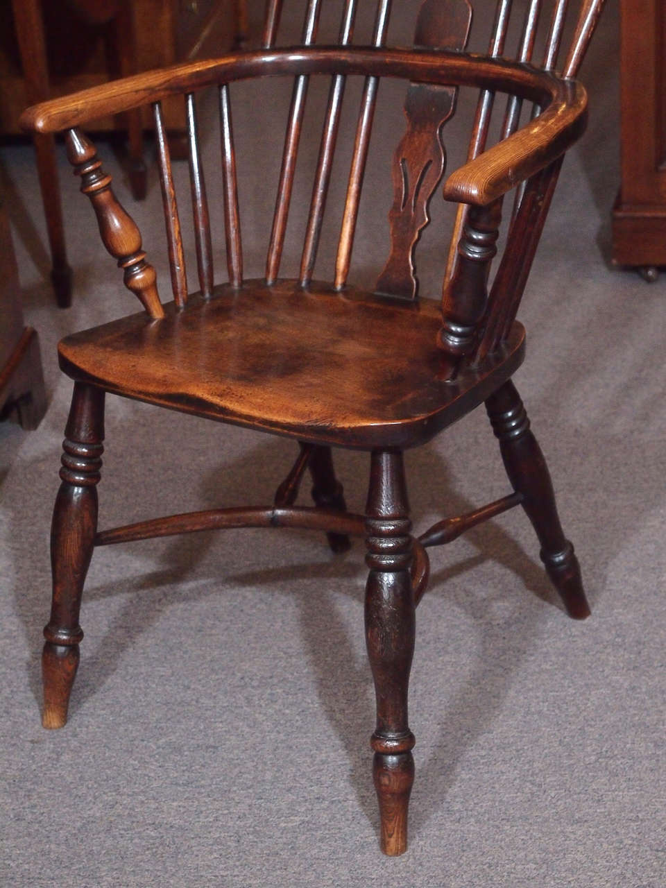 Antique English elm and ash Windsor chair with crinoline stretcher. at