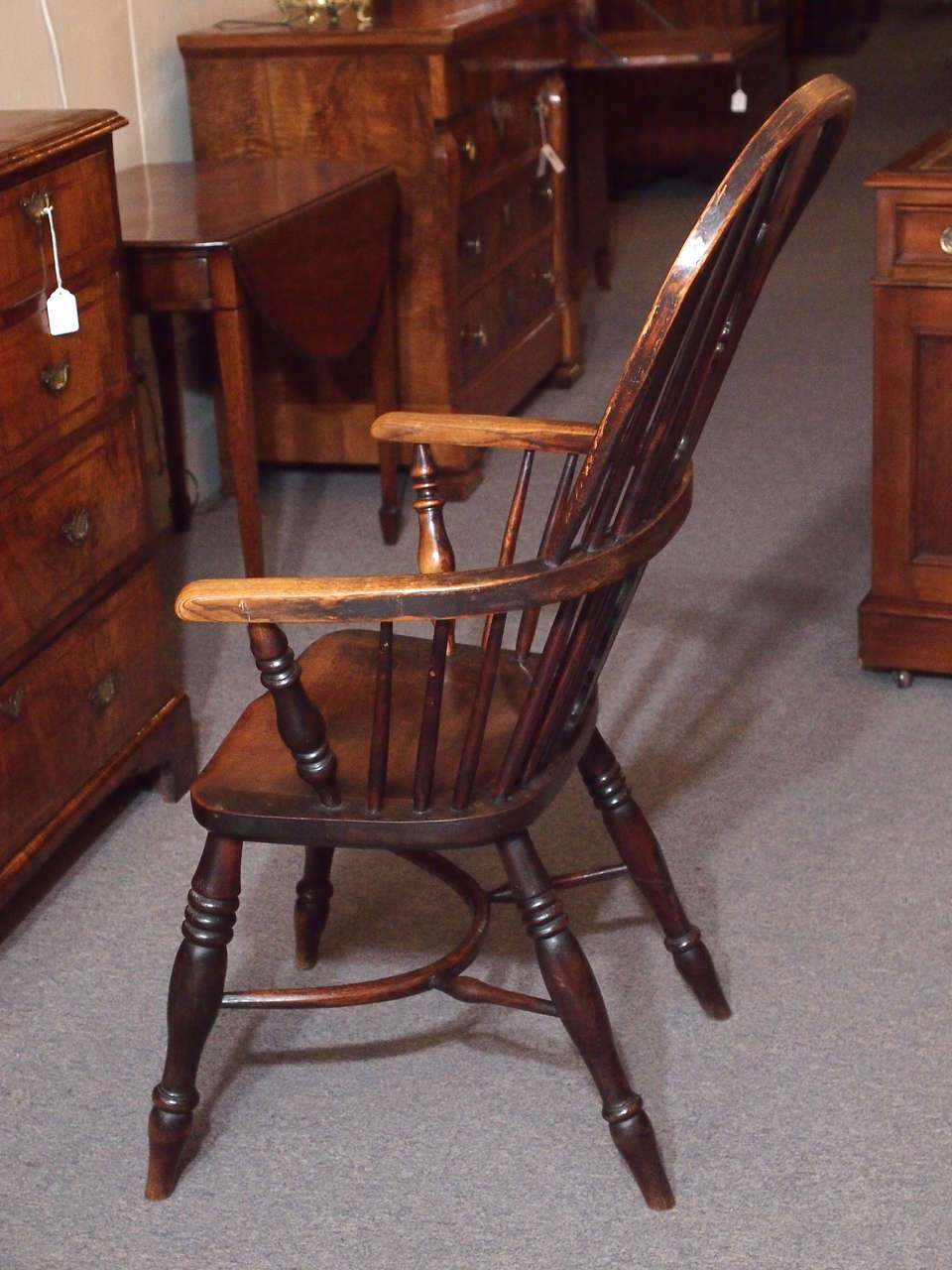 Antique English elm and ash Windsor chair with crinoline stretcher. at