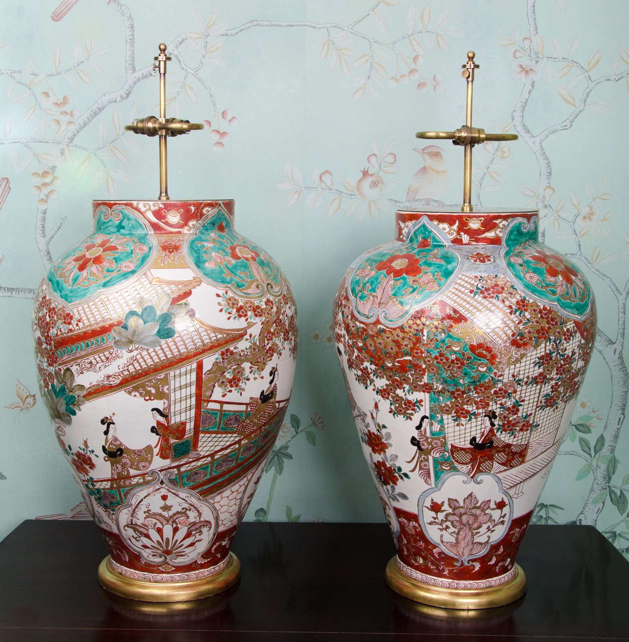 A pair of very large and impressive Japanese late 17th / early 18th century Imari vases decorated in the rare palette of underglaze red (two shades) with overglaze iron-red, pale blue and green enamel with details in gold. The decoration shows large