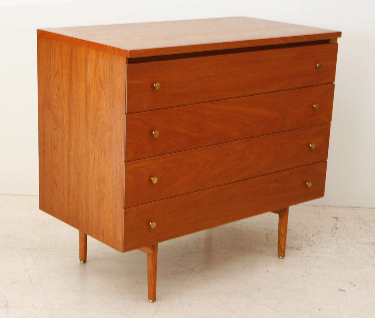 Walnut chest by Paul McCobb for Calvin with rare base and hardware.