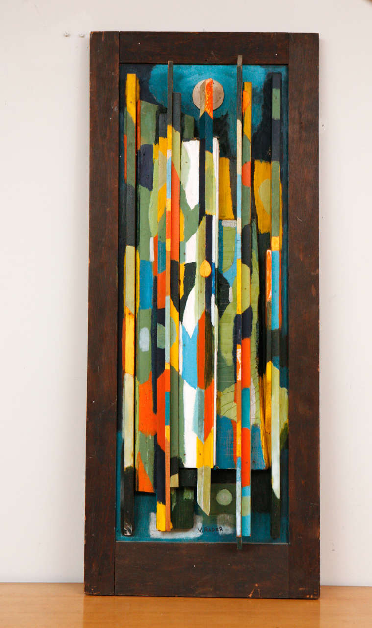 Painted wood relief sculpture by Vernon Rader.