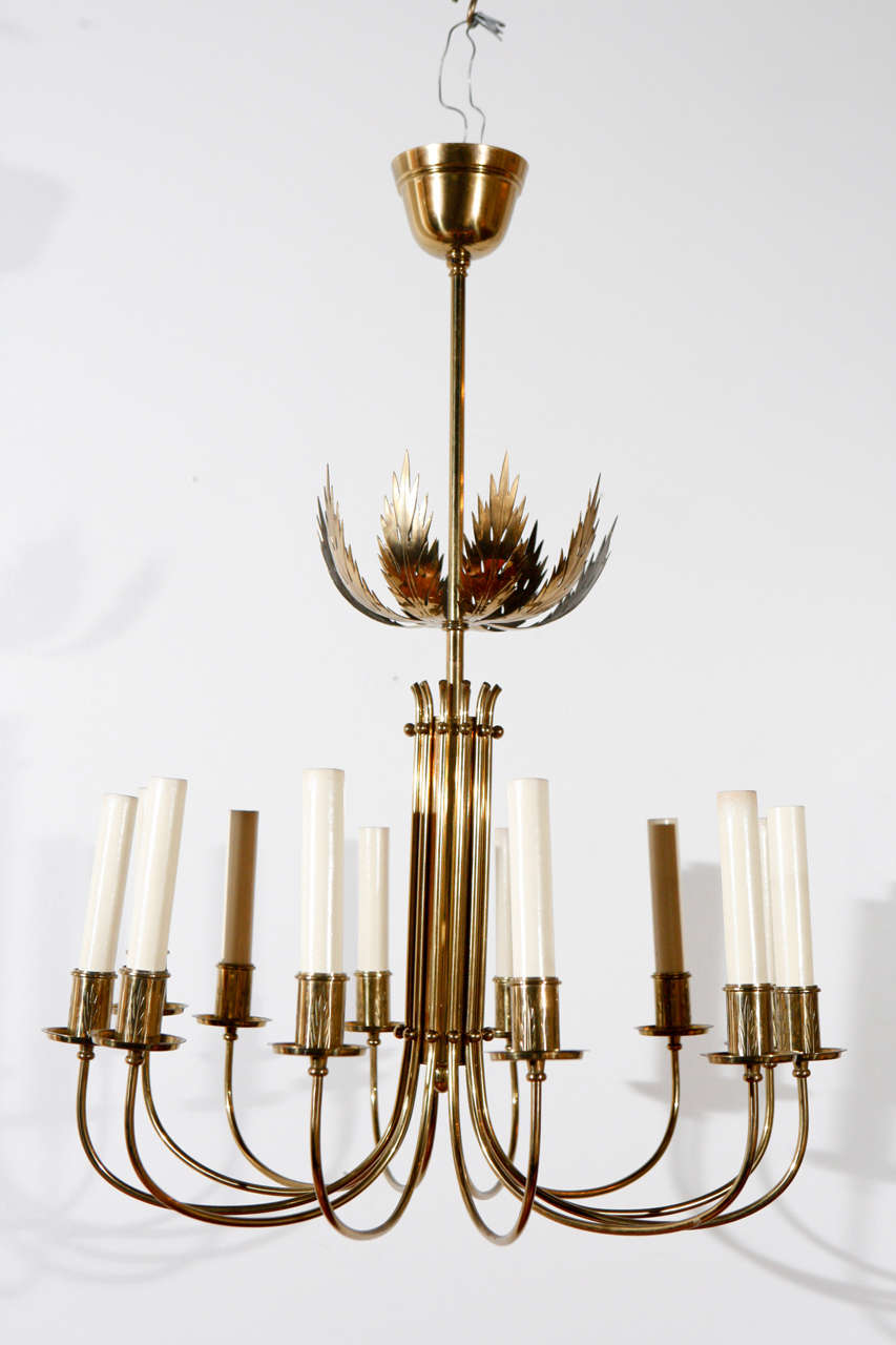 Brass Italian chandelier newly rewired for 12 candelabra bulbs.