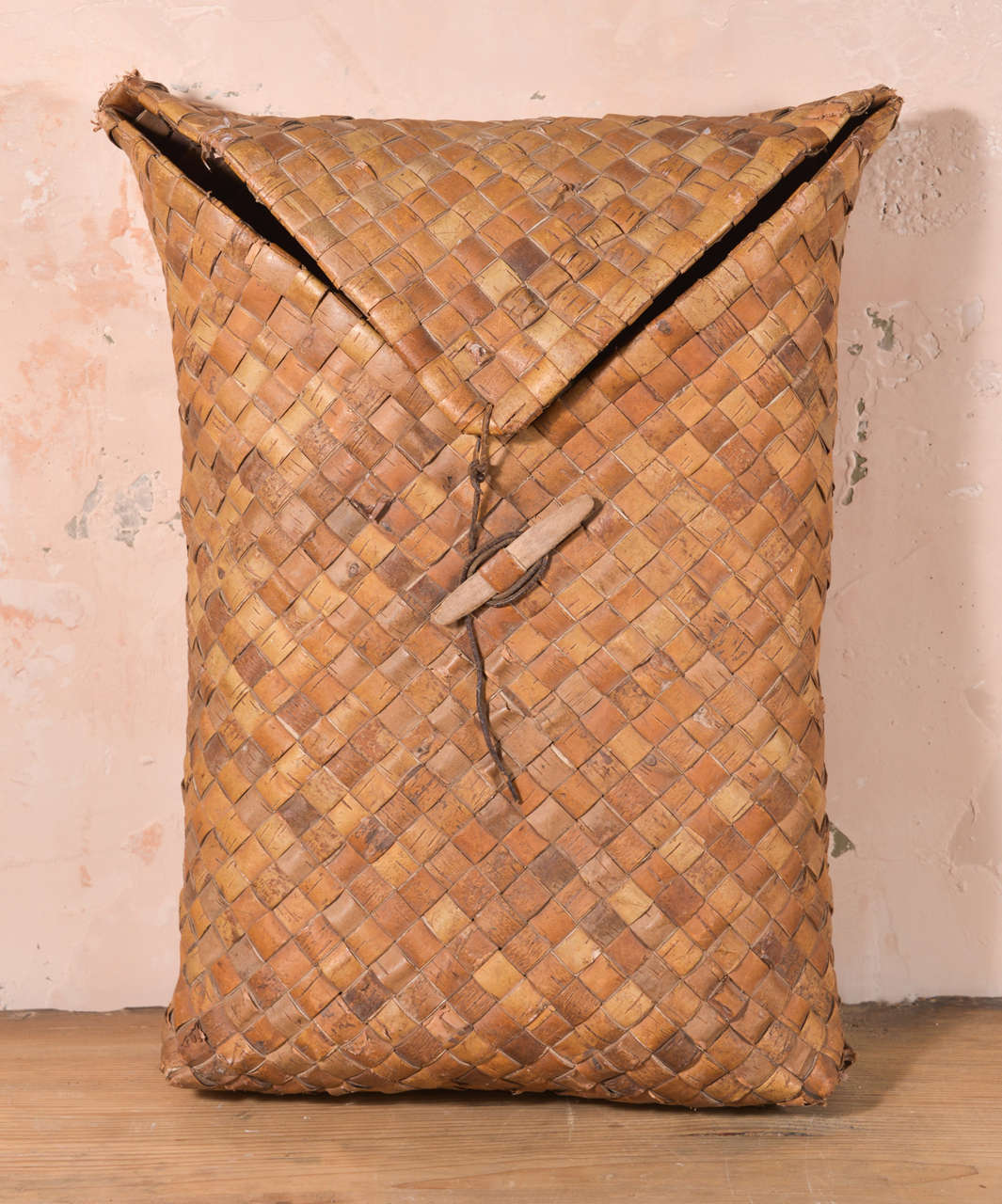 Swedish fruit basket. This charming woven construction basket closes with flap secured by leather strap.