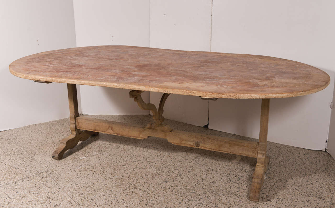 Late 19th c large wine tasting table in pine and oak. Traces of old paint on the top. Top tilts.