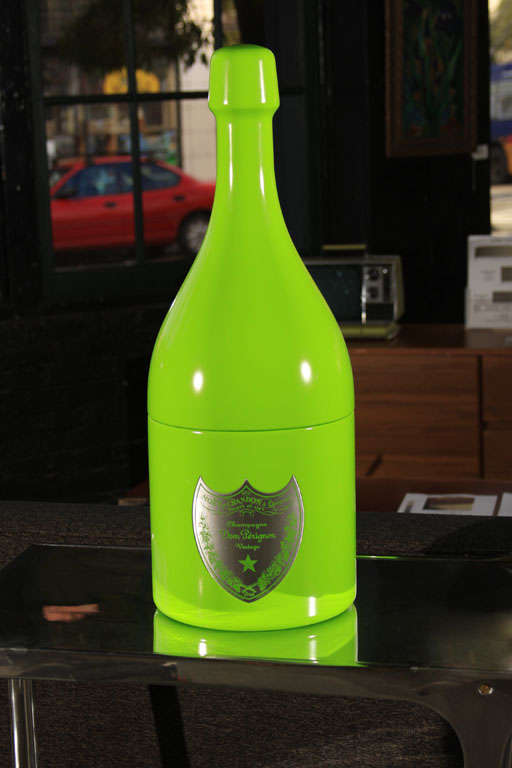 This cooler was the first creation from Dom Perignon Designers' Studio. Marc Newson reinterpreted the iconic Dom Perignon bottle into a monolithic, neon green cooler. Limited edition of 1000. This is #989, complete with certificate of ownership