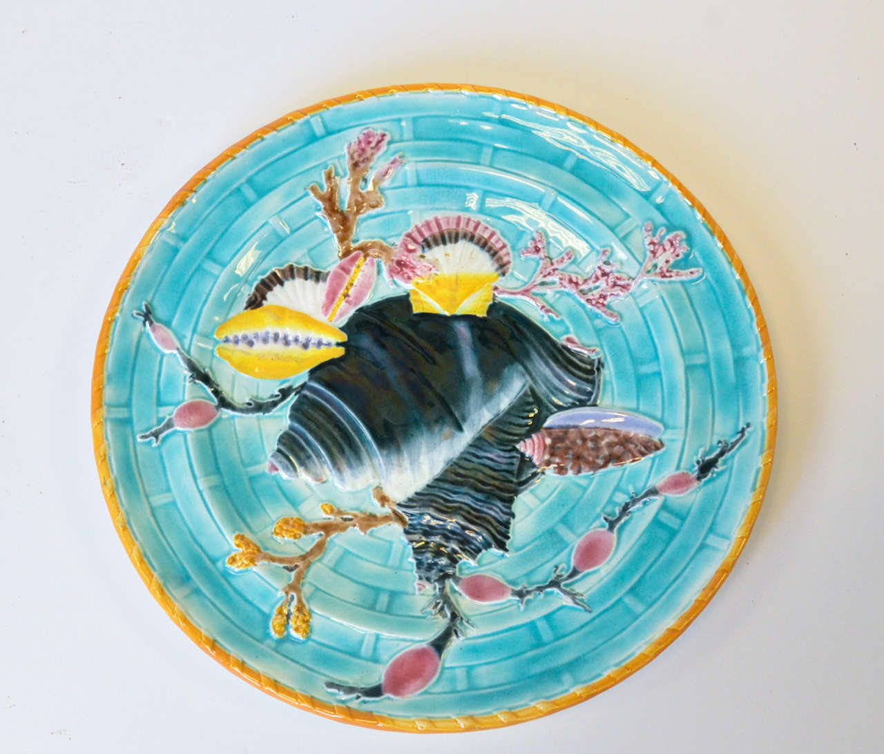 Wedgwood is a very fine china company from England that hired many exceptional artists who created majolica from approximately from 1860 - 1900.  The shell and seaweed pattern was a dish that was typically exported from England, due to the bold