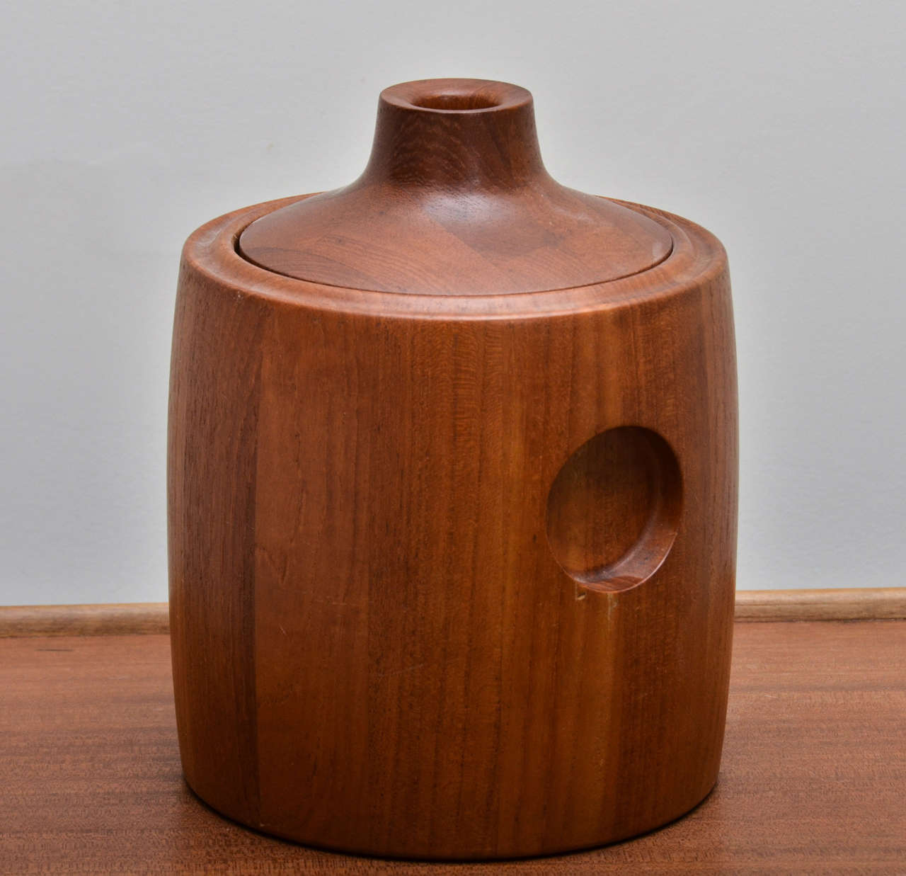 Midcentury teak ice bucket with removable lid and plastic lined and insulated interior. Signed and stamped on bottom by GT Jensen, Denmark.