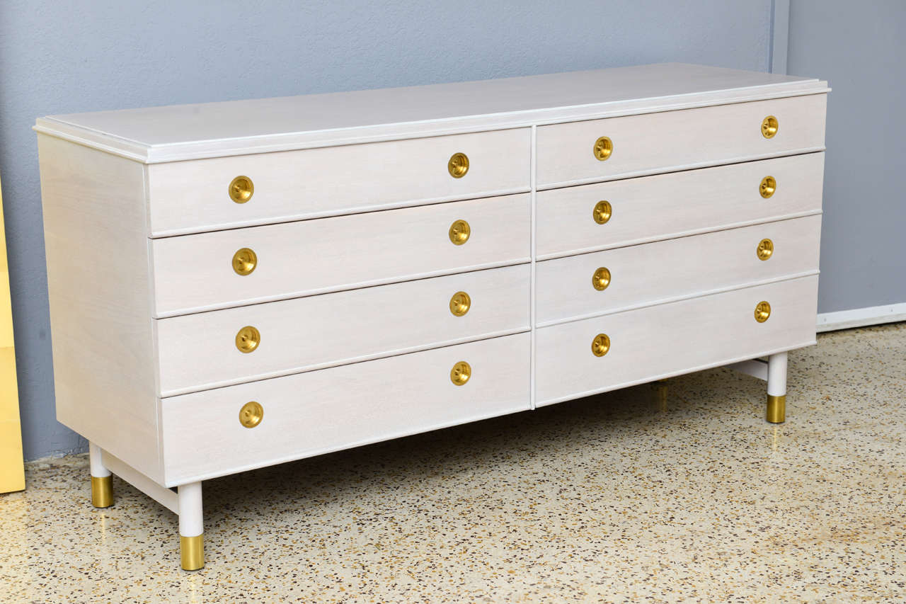We've completely restored this Renzo Rutili-designed, bleached mahogany and European walnut dresser. Polished solid brass hardware provides striking and rich contrast to the bleached wood, which we've white-washed to an even dreamier, paleness. A