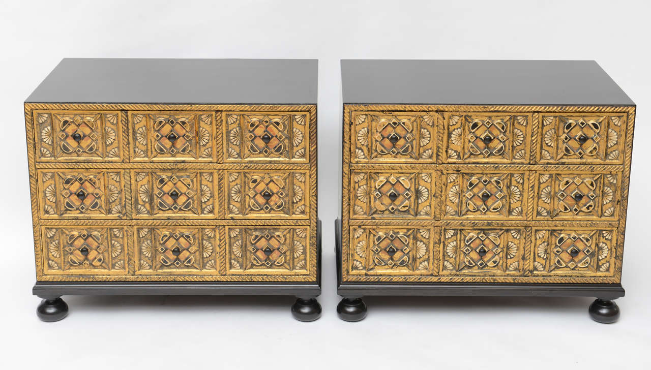 Gorgeous Spanish Baroque-inspired night stands by William A. Berkey Furniture for Widdicomb feature heavily carved drawer fronts with gold leaf details and ebonized walnut bodies.
