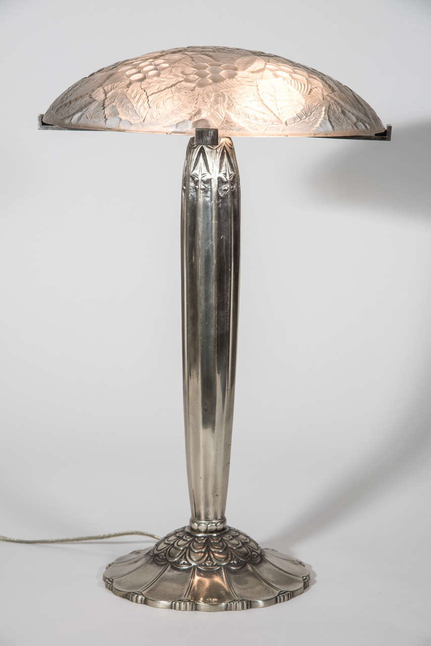 Stylized silvered bronze stem and molded glass dome with leaves and grape motif in the style of Sabino.