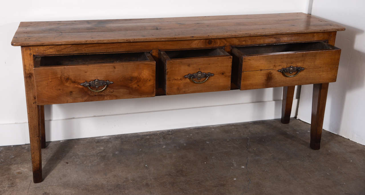 19th Century Narrow French Fruitwood three-drawer server. Circa 1840  Perfect for use behind a sofa.