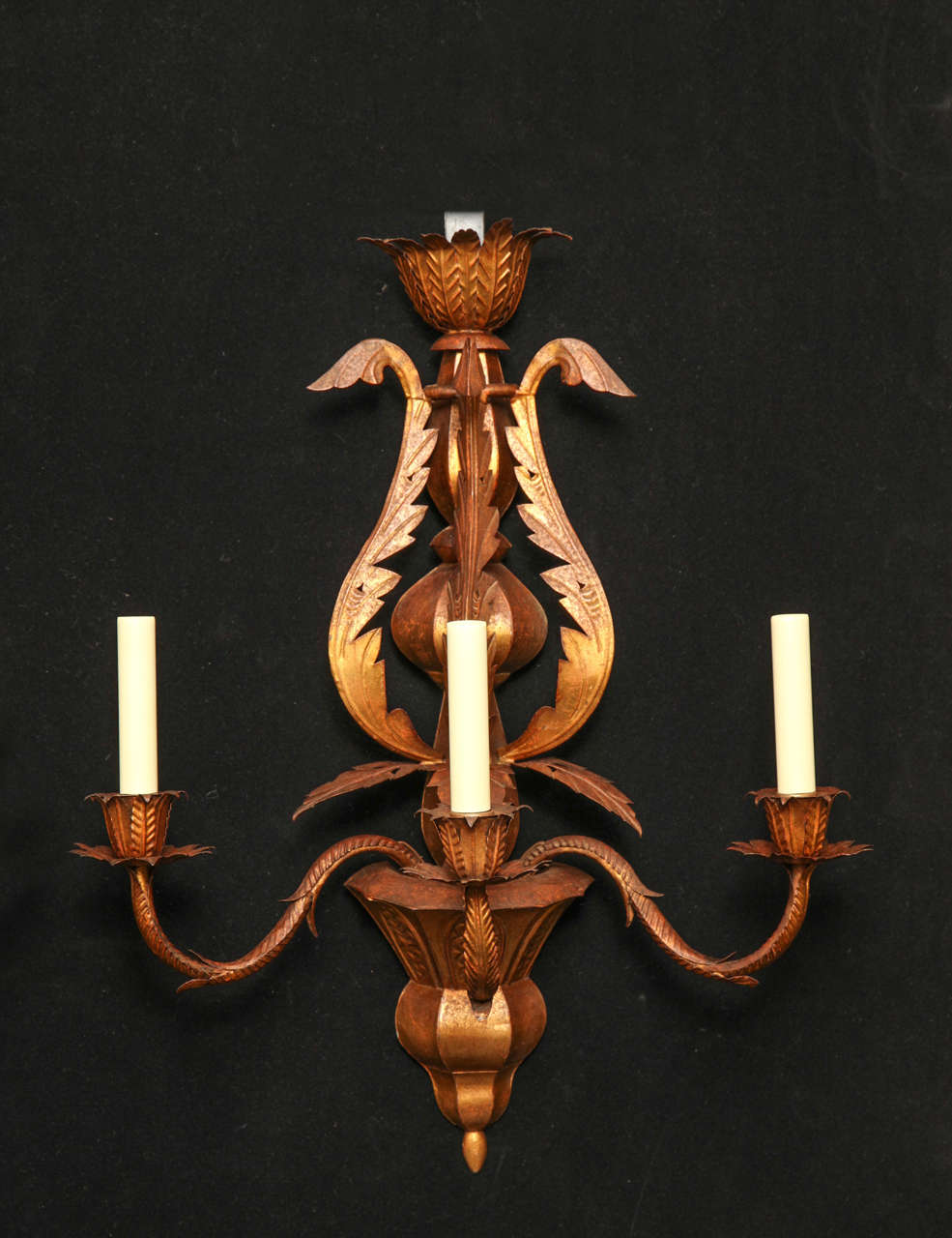 Pair of Gilded Tole Three Light Sconces.  Each Arm Is Supported By A Central Urn.  The Sconces Are Decorated With Exaggerated Acanthus Style Leaves.