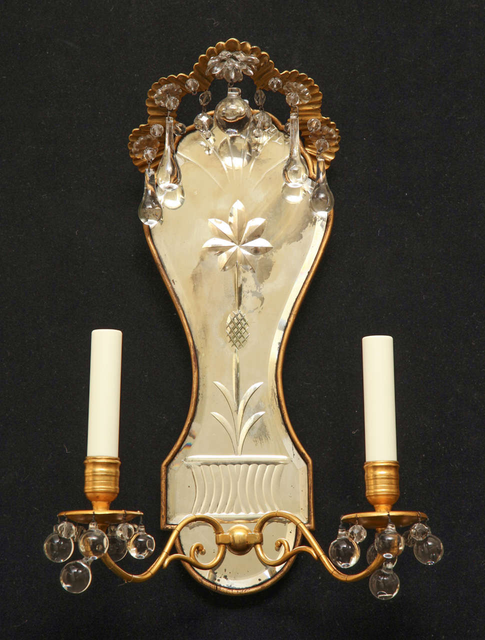 Pair of etched mirrored back two-light sconces with a bronze crenelated top supporting crystal trims.