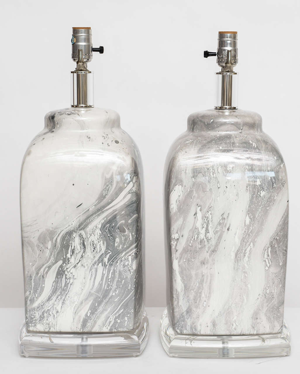 Whether on paper, furniture, or accessories, we are such fans of marbling. This dreamy pair of 70's glazed ceramic lamps have grey-on-white marbling with lucite bases and finials. Height measurement below is to top of socket. (Shades not included.)