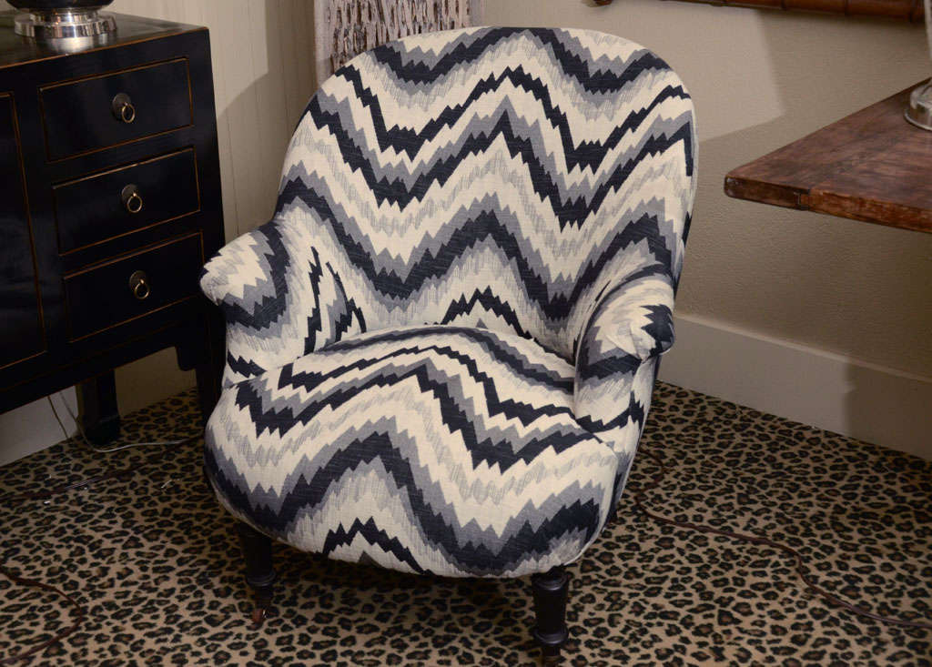 France, Napoleon style chair, France, circa 1880.

Napoleon III chair in modern black, gray and white chevron pattern. Newly restored and upholstered with ebonized walnut legs with castors. Adds a French modern touch to the room!