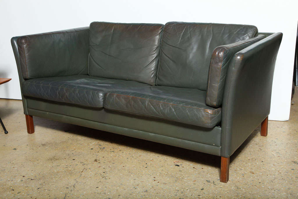 Graceful 6 Cushion Slate Green Leather Love Seat on wooden legs