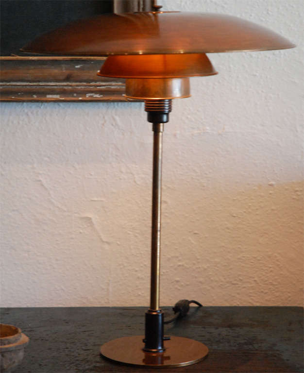 Poul Henningsen. PH 4.5 table lamp, 1930's. patinated brass stem. Bakelite , cast wire shade holder with copper shade set. Produced by Louis Poulsen.