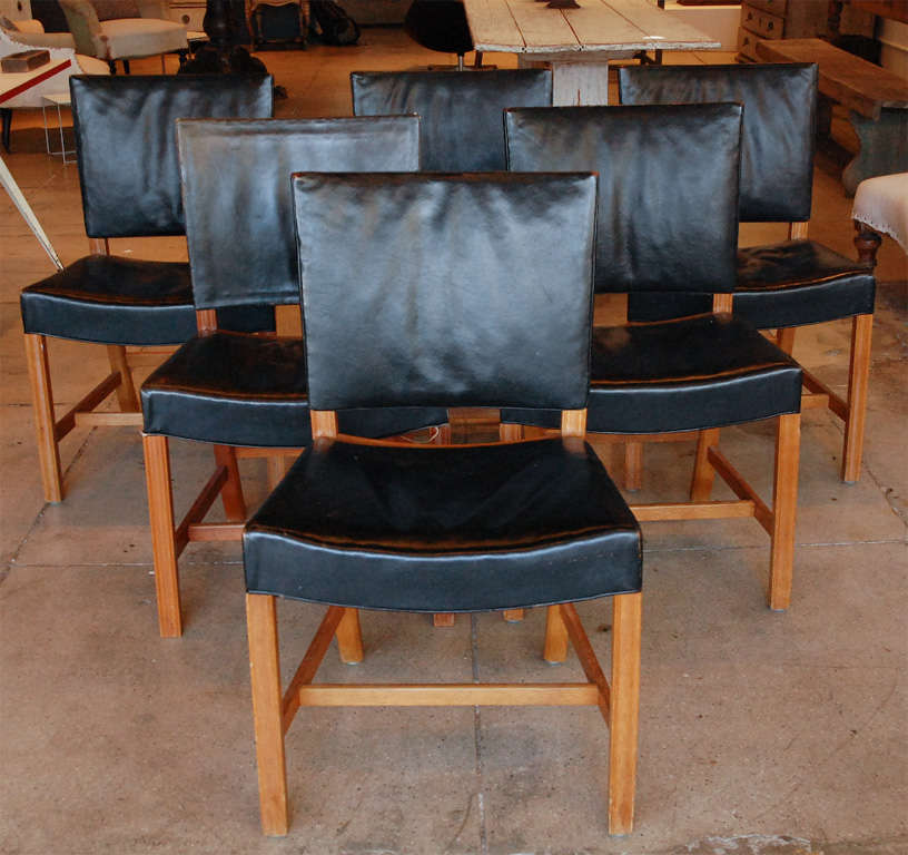 a set of six kaare klint dining chairs in their original mahogany wood frames & black leather upholstery. solid & useable. sold only as a set.
produced by rid rusmussen.