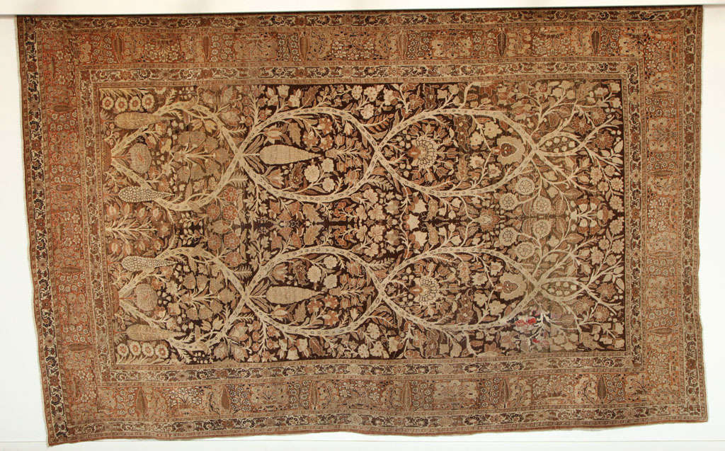 This Persian Haji Jalili Tabriz carpet created circa 1870 consists of a cotton warp and weft, hand-knotted wool pile and organic vegetal dyes. It is an exceptionally Fine example from the master artist and weaver Haji Jalili, and was crafted using