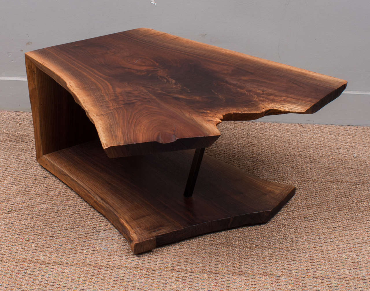 Striking one of a kind cocktail table crafted from one piece of walnut wood in the style of Nakashima.
