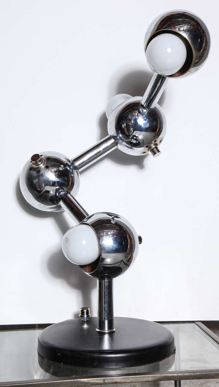 Fun chrome vintage lamp with four spherical  shades spaced 10
