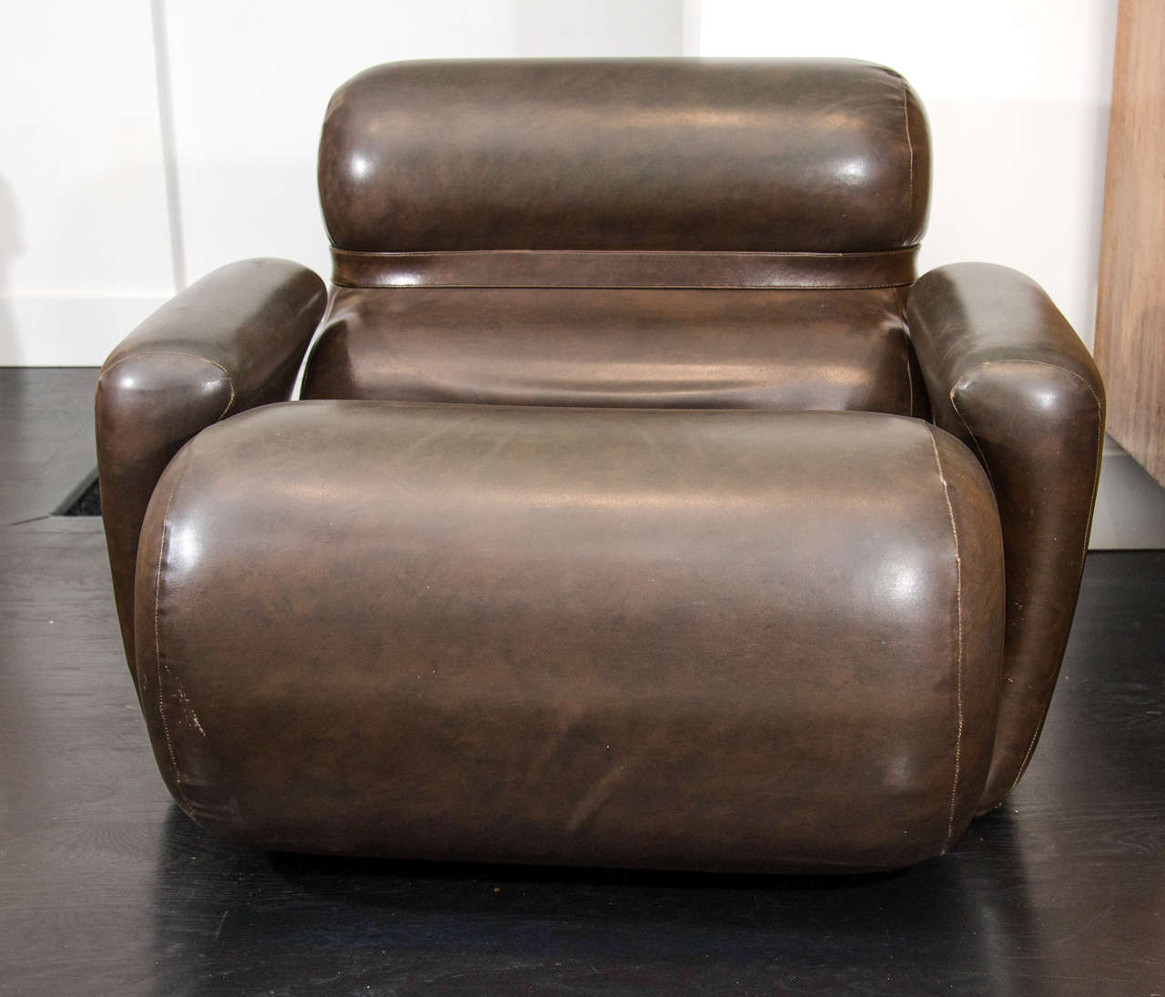 Injected foam, vinyl wrapped lounge chair form the 1970s. Original upholstery, open to customization. Pair available.