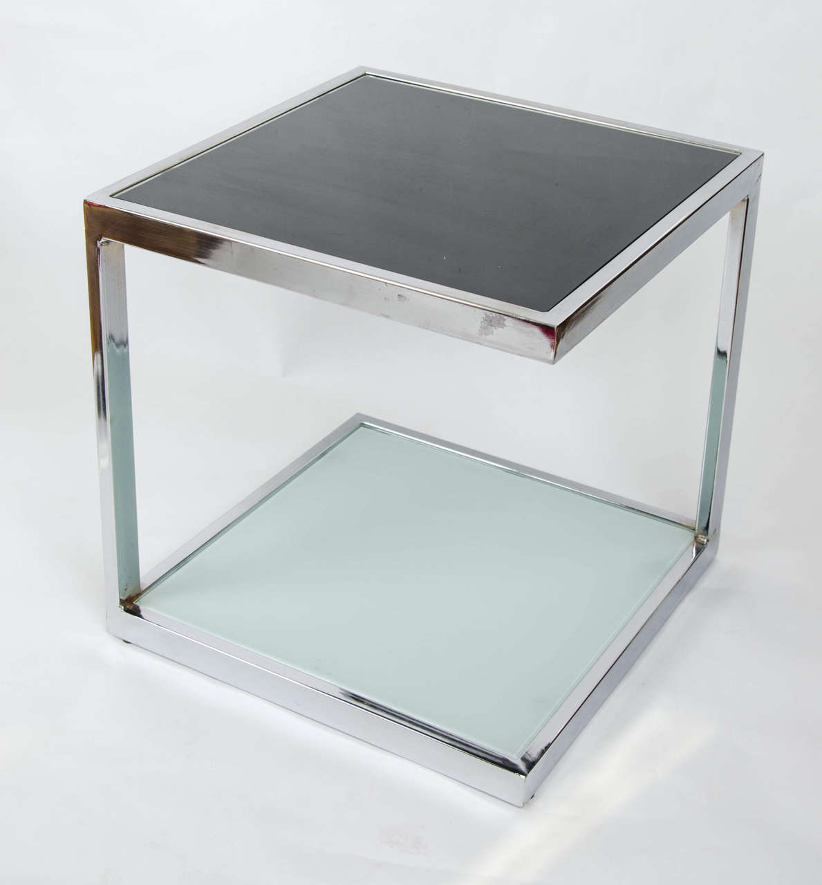 Elegant minimalism. Two pairs of sturdy mid-century French cube side tables in chrome and glass.

Price quoted based on a pair. Four available.