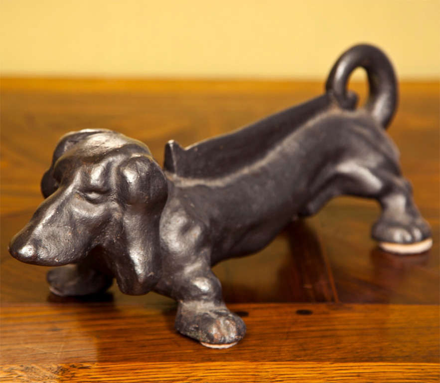 Adorable bronze dachshund dog boot scraper