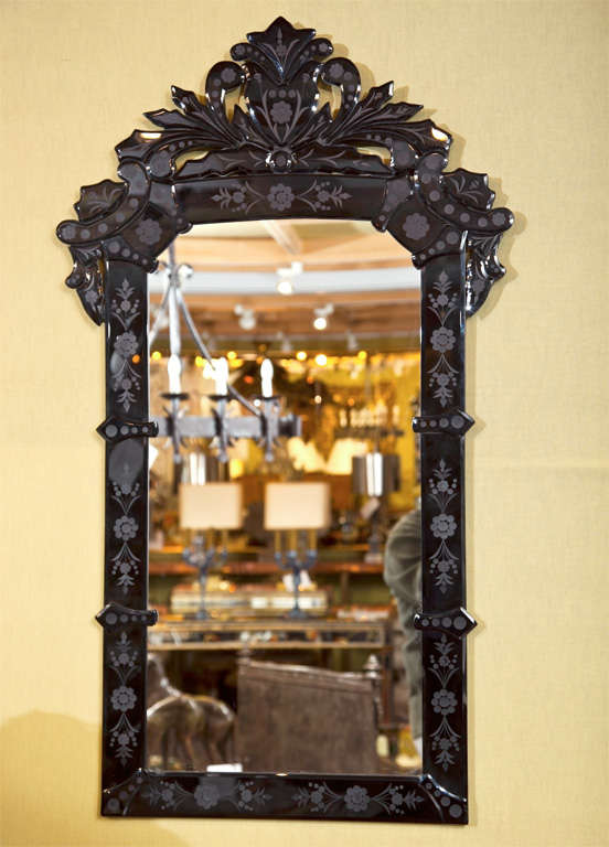 Pair of black glass Venetian style mirrors having border glass with copper wheel engraved stylized flowers
