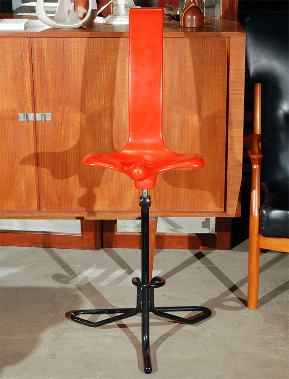 Adjustable orange plastic oblong stool w/black painted metal base