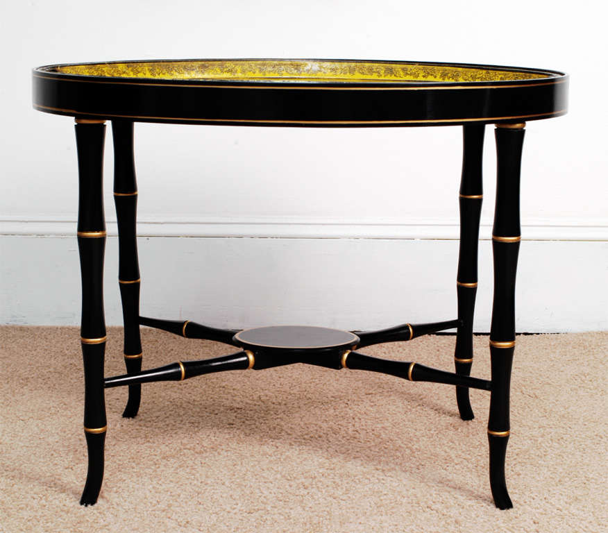 Yellow ground with scenes from classical Roman history – captions in French – hand rolled – hand holes in sides of tray. Hand made stand (removable) custom made in our cabinet shop to fit tray precisely, in black and gold painted faux bamboo.