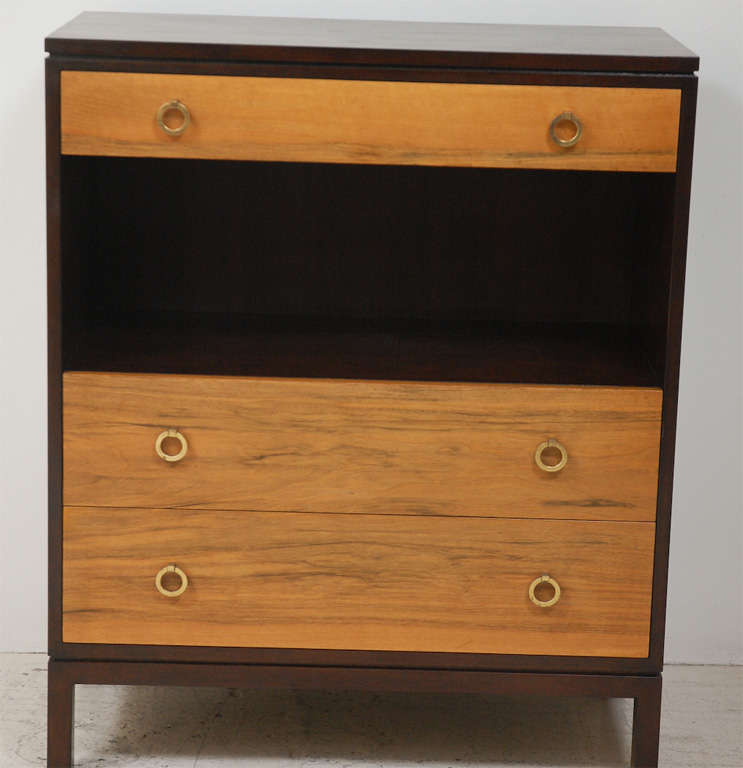 Dunbar Green Label Dresser with three drawers and one open shelf for additional storage.  Brass ring hardware.  Medium walnut case with bleached walnut drawers fronts.
By Edward Wormley. Rare custom version.