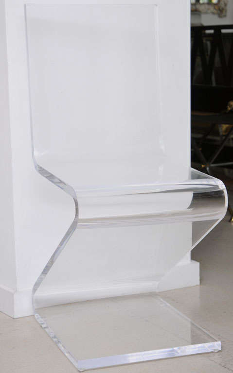 Set of six lucite zigzag dining chairs- heavy and attractive from all angles.