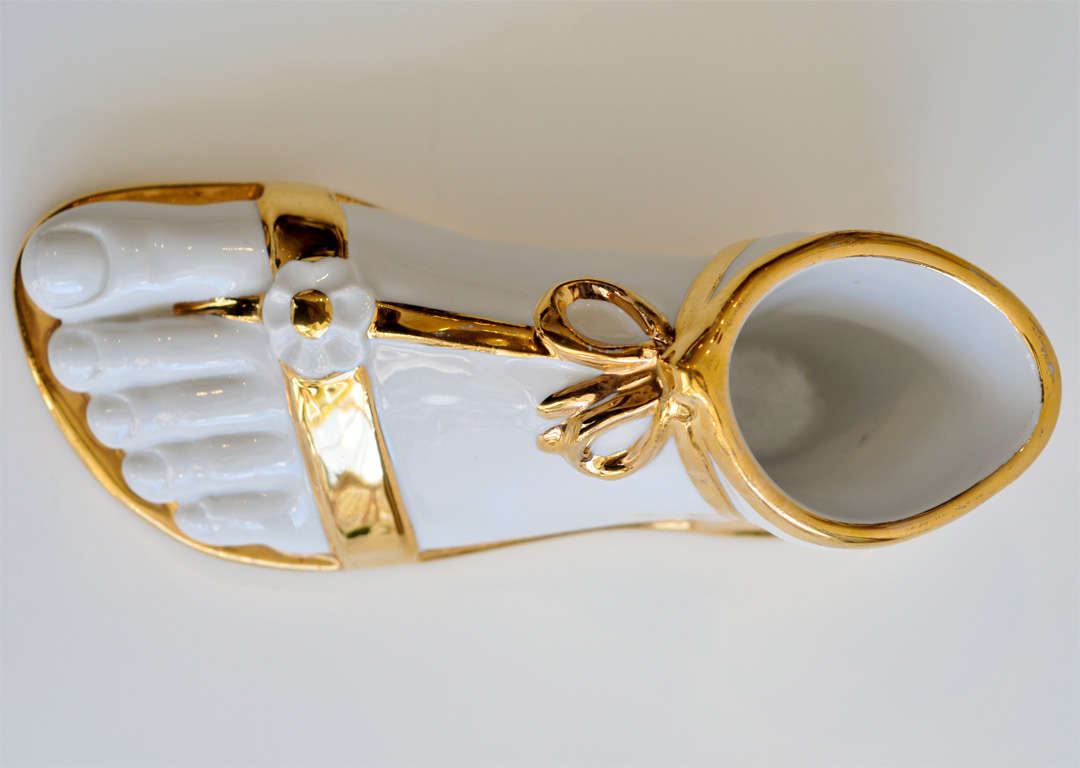 A gilt ceramic foot showing the influence of classical sculpture and surrealism in Fornasetti's work. Similar examples are shown in Fornasetti's own home, the Villa Varenna on Lake Como. See Fornasetti Designer of Dreams, p.133.