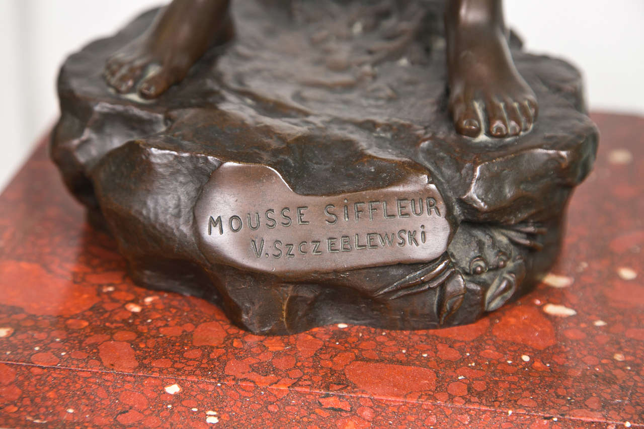 whistling boy statue