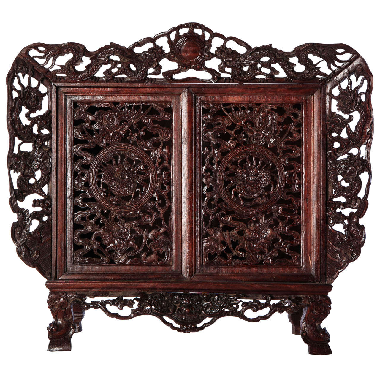 A Chinese  small openwork wood cabinet depicting Dragons